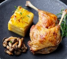 duck legs confit with potato gratin and mushroom s HMBACUZ
